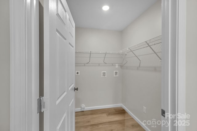 washroom with washer hookup, wood-type flooring, and hookup for an electric dryer