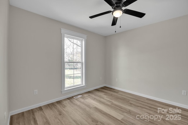 unfurnished room featuring ceiling fan and light wood-type flooring