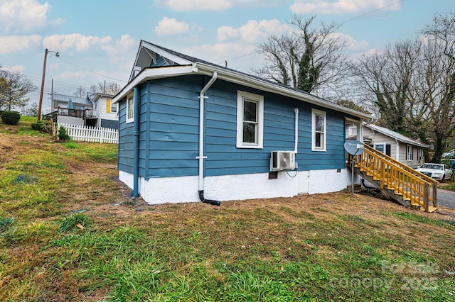 view of side of property with a yard