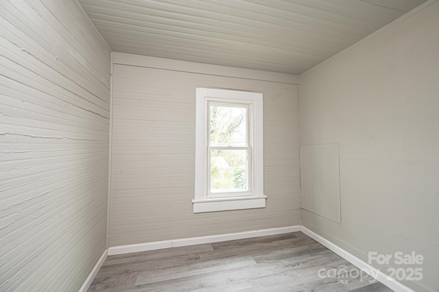 unfurnished room featuring wood-type flooring