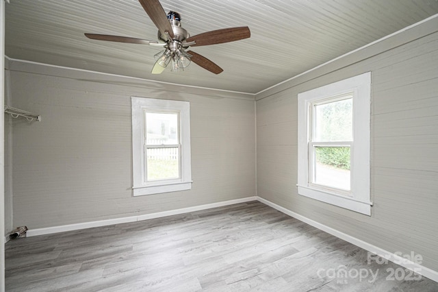 unfurnished room featuring hardwood / wood-style flooring and ceiling fan