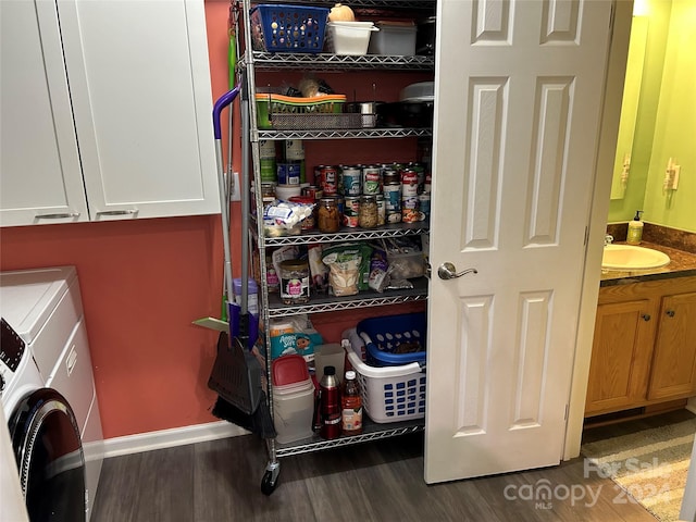 pantry with sink and washing machine and clothes dryer