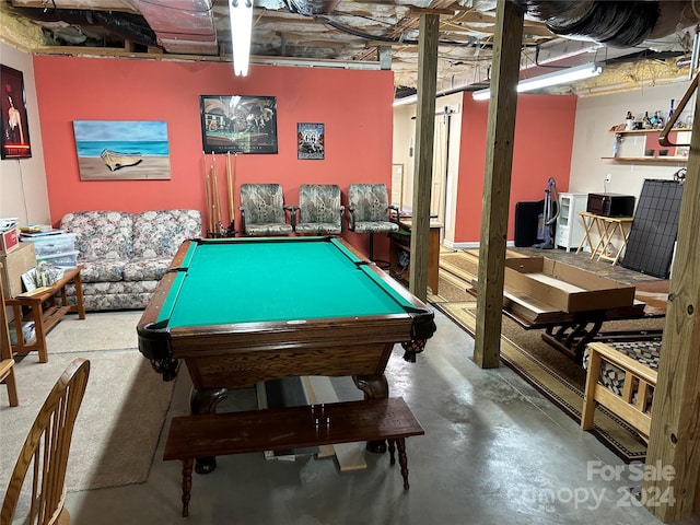 playroom with concrete flooring and billiards