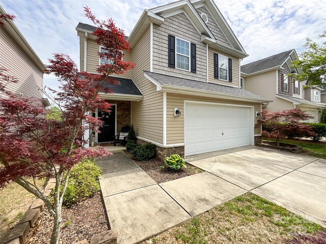 1096 Mountain Laurel Ct, Matthews, NC 28104 - view of front of property with a garage, driveway, and stone siding
