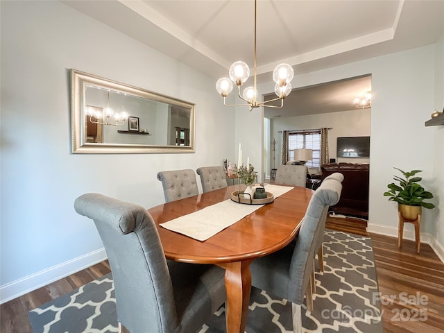 1096 Mountain Laurel Ct, Matthews, NC 28104 - dining space with a chandelier, wood finished floors, baseboards, and a raised ceiling