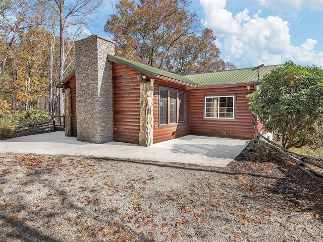 view of property exterior featuring a patio