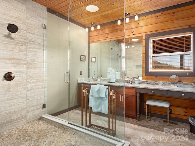 bathroom with vanity, wooden ceiling, and a shower with shower door