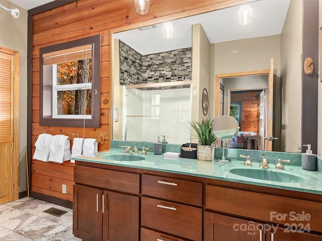 bathroom with vanity and wooden walls