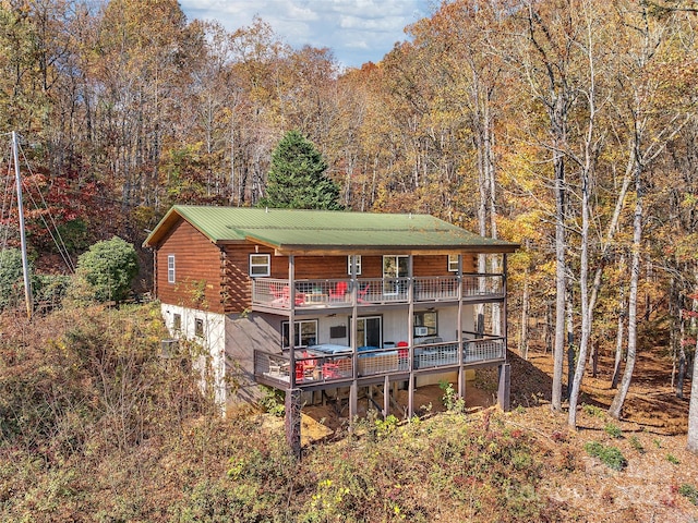 rear view of house with a balcony