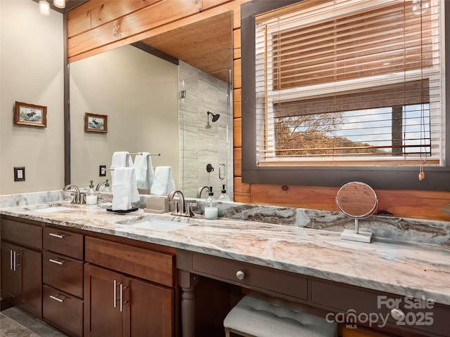 bathroom with vanity and an enclosed shower