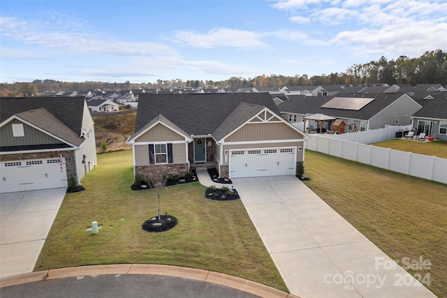 craftsman-style home with a front yard