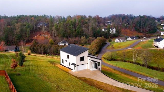 aerial view featuring a forest view