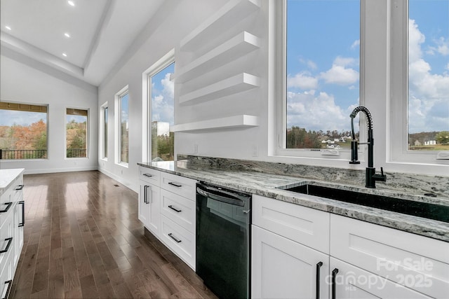 kitchen with white cabinets, dishwasher, a sink, and open shelves