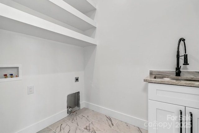 clothes washing area with baseboards, marble finish floor, hookup for a washing machine, hookup for an electric dryer, and a sink