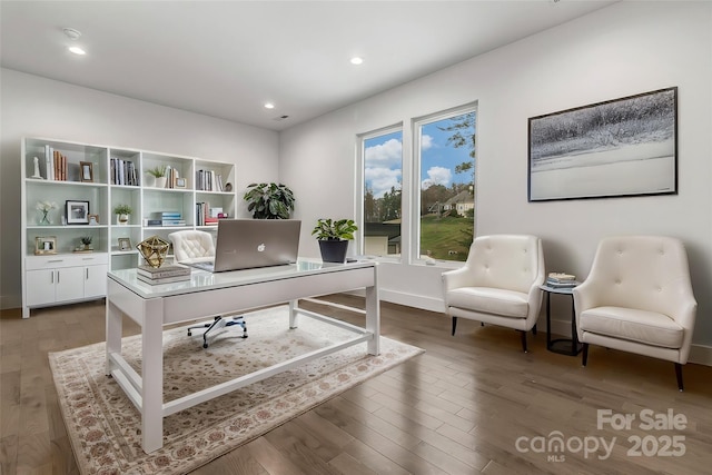 office space with recessed lighting, baseboards, and wood finished floors