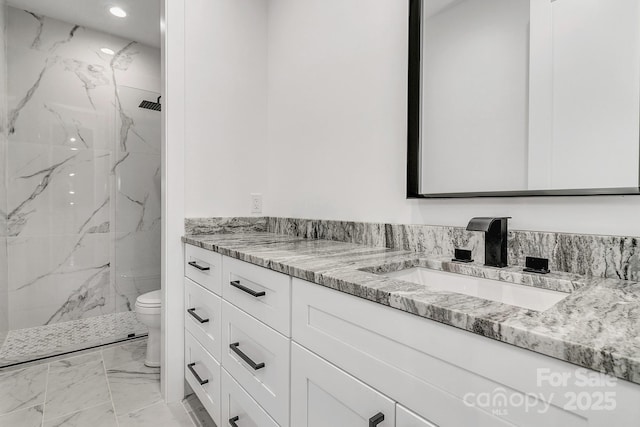 full bathroom featuring toilet, recessed lighting, vanity, marble finish floor, and a marble finish shower