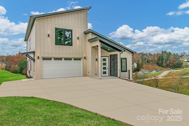 view of front of property featuring an attached garage, board and batten siding, and concrete driveway