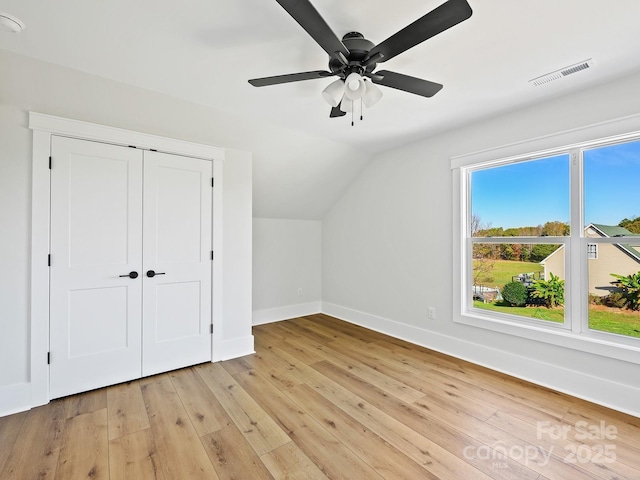 additional living space featuring lofted ceiling, ceiling fan, and light hardwood / wood-style flooring