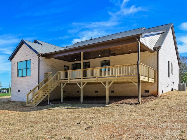 rear view of house with central AC, a deck, and ceiling fan