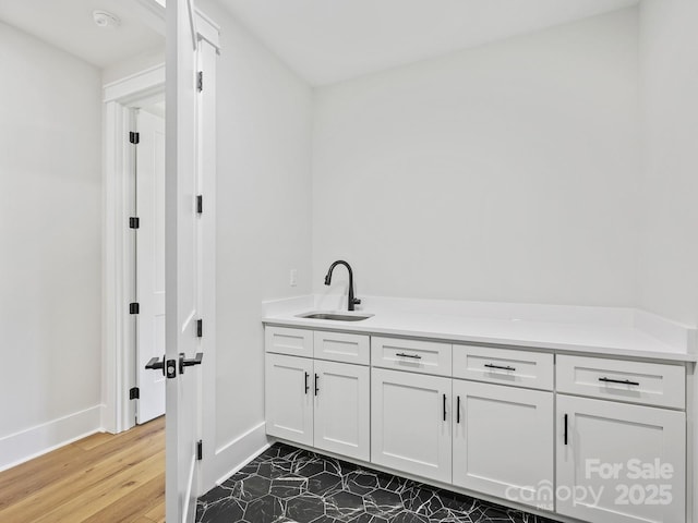 bathroom featuring hardwood / wood-style flooring and vanity