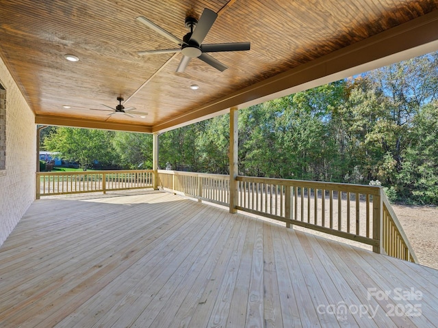 wooden terrace featuring ceiling fan