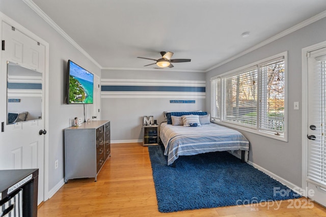 bedroom with ceiling fan, light hardwood / wood-style floors, and ornamental molding