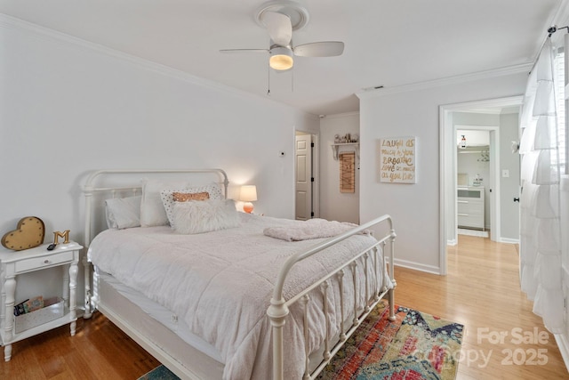 bedroom featuring ceiling fan, ornamental molding, and light wood-type flooring