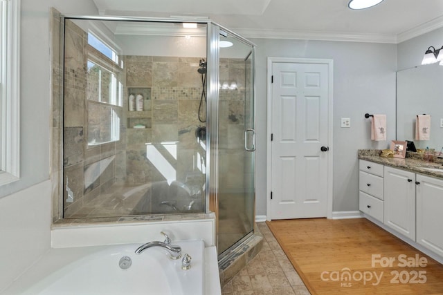 bathroom featuring tile patterned floors, vanity, an enclosed shower, and ornamental molding