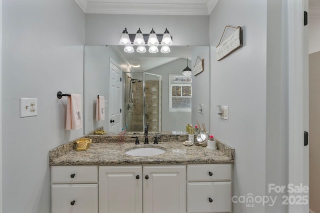 bathroom featuring vanity, an enclosed shower, and crown molding