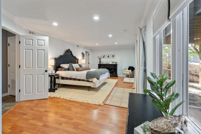 bedroom featuring hardwood / wood-style floors and ornamental molding