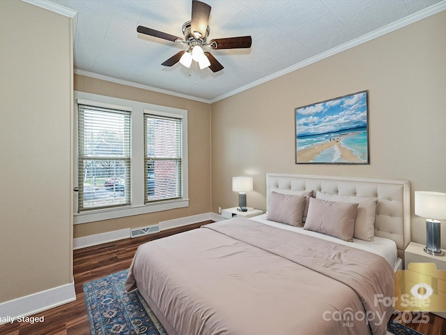 bedroom featuring ceiling fan, crown molding, and dark hardwood / wood-style floors