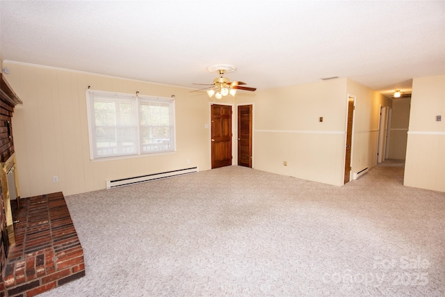 unfurnished living room with a brick fireplace, a baseboard radiator, ceiling fan, and carpet