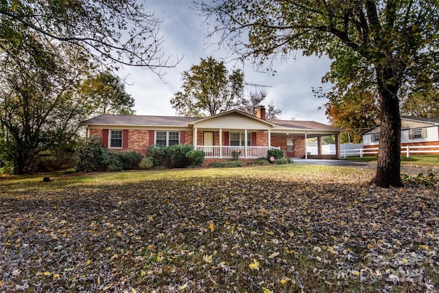 single story home with a carport and covered porch