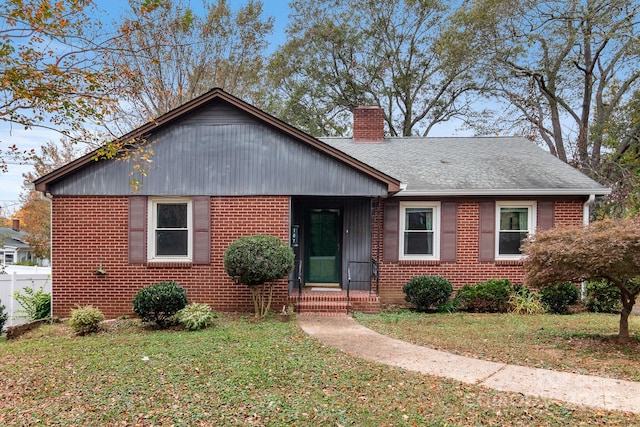 bungalow-style home with a front lawn