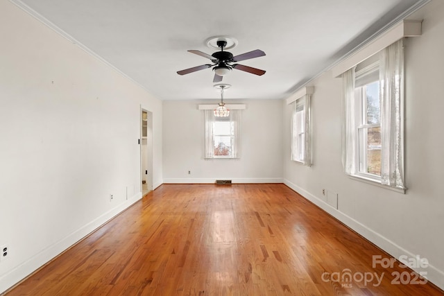 spare room featuring light hardwood / wood-style floors and ceiling fan