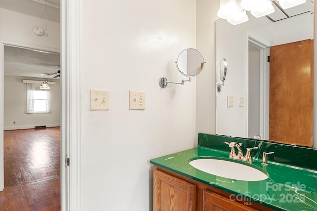 bathroom with ceiling fan and vanity