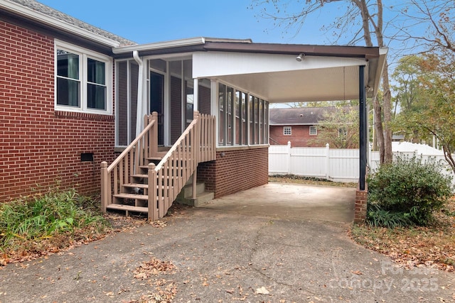 view of side of home featuring a carport