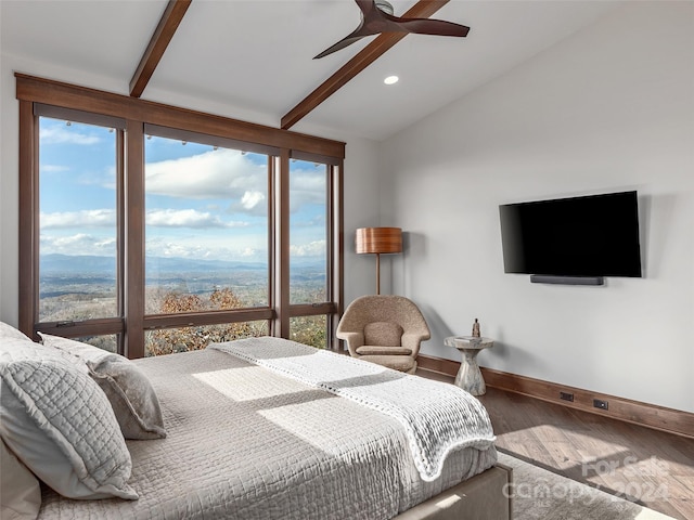 bedroom with vaulted ceiling with beams, hardwood / wood-style flooring, and ceiling fan