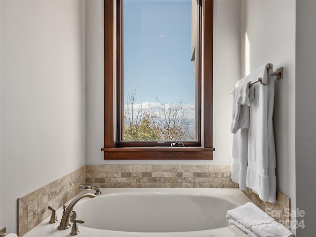 bathroom with a tub