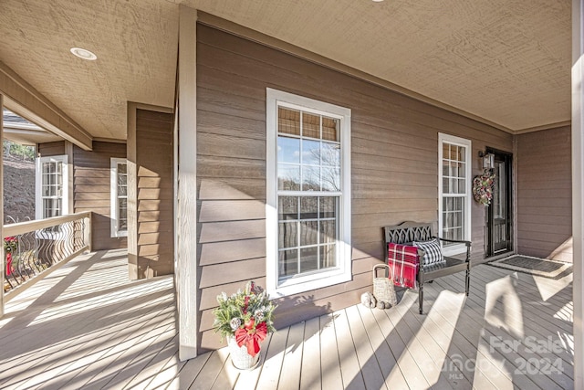 wooden terrace with covered porch