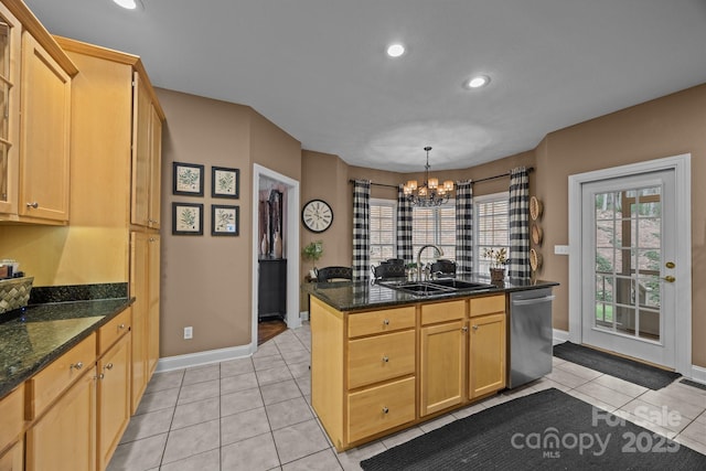 kitchen with a notable chandelier, dishwasher, sink, decorative light fixtures, and light tile patterned flooring