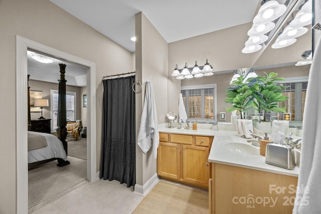 bathroom with tile patterned floors and vanity