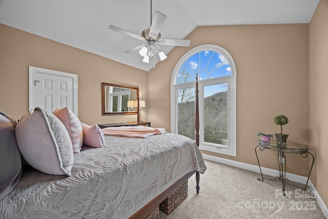 carpeted bedroom with ceiling fan and lofted ceiling