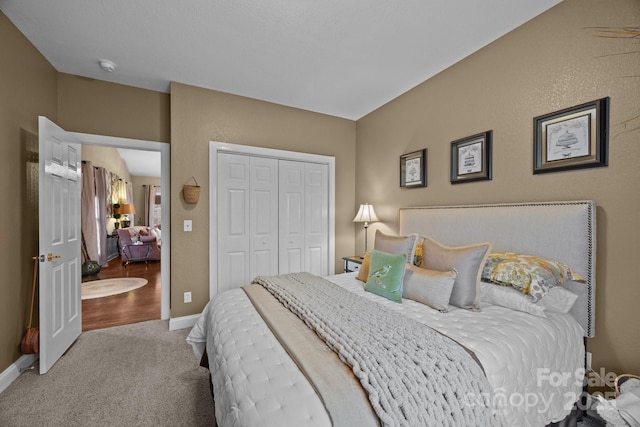 bedroom with a closet and carpet