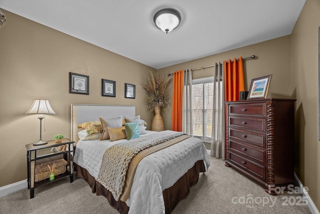 bedroom featuring light carpet