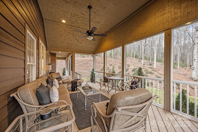 sunroom / solarium with ceiling fan, wood ceiling, and vaulted ceiling