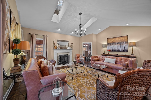 living room featuring vaulted ceiling with skylight and a notable chandelier