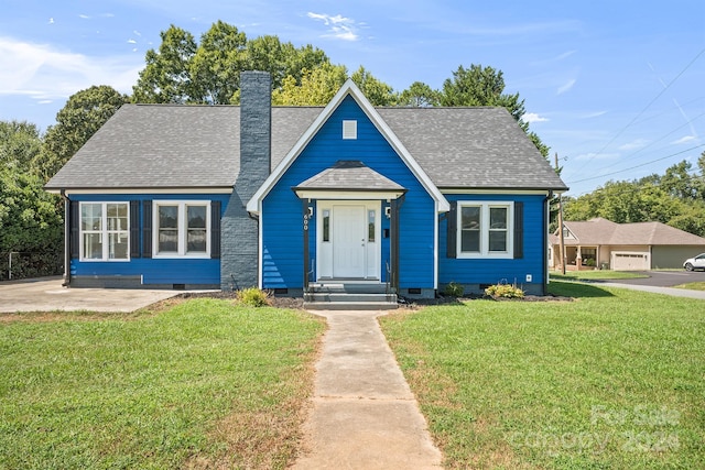 bungalow-style home with a front yard