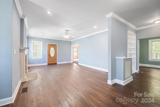 unfurnished living room with crown molding, dark hardwood / wood-style floors, and ceiling fan