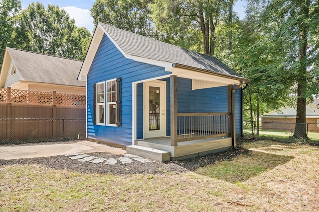 view of outbuilding with a lawn